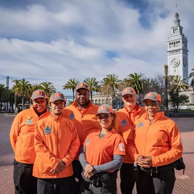 San Francisco's Welcome Ambassadors prepare to greet visitors at 的 Ferry Building.